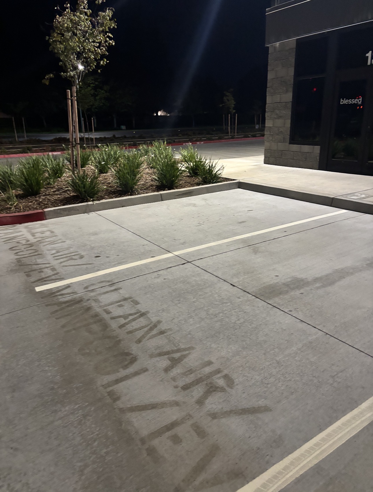 Commercial parking lot before pressure washing